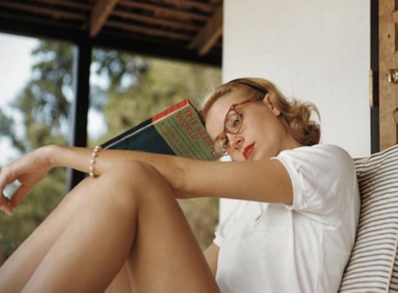Grace Kelly reading a book