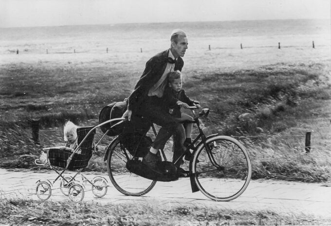 Dad biking with kids