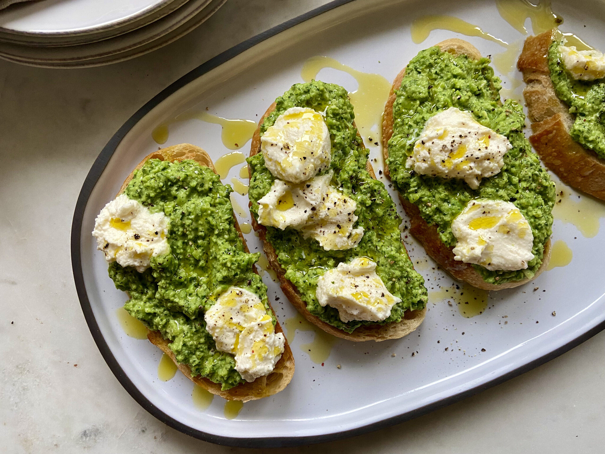 Smashed Pea Toasts with Ricotta