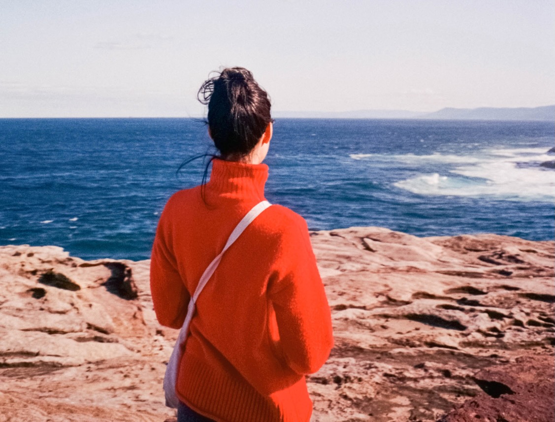 woman looking to ocean