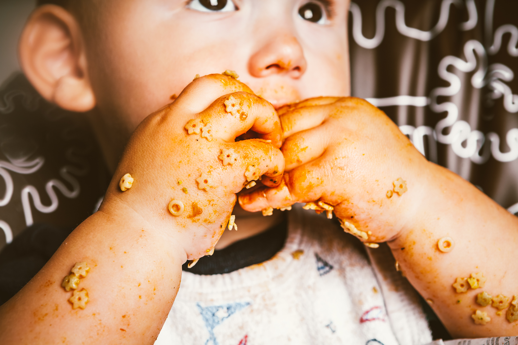 toddler eating pasta